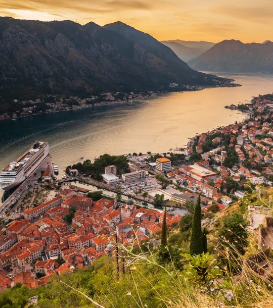 Top view of the old city of Kotor and the Kotor Bay in Montenegro. Sunset view of the Illlyrian Fort over the city of Kotor